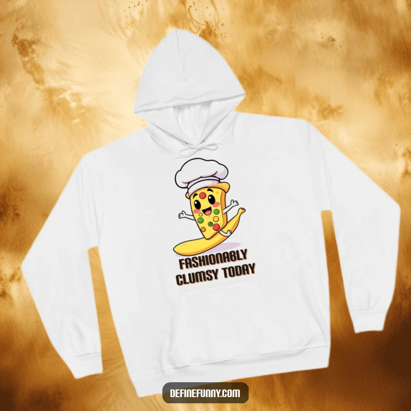 Funny hoodie depicting a pizza slice chef in a chef hat slipping dramatically on a banana peel, promoting cozy laughs.